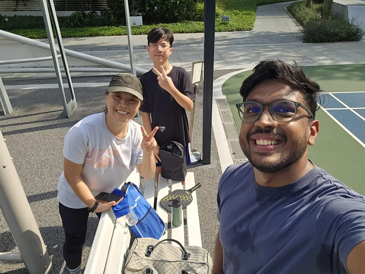 Pickleball players at a court in Singapore with MGM coach
